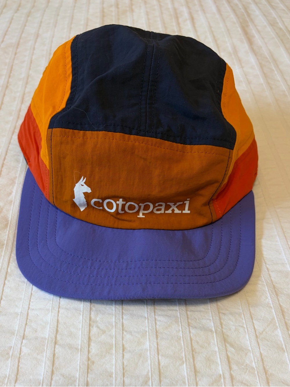 COTOPAXI- Tech 5-Panel Hat in the limited-edition Mezcal / Amethyst colorway.